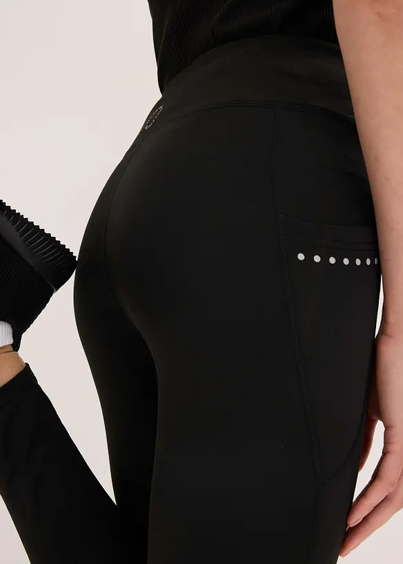 Varmende leggings med refleksdetaljer og mobillomme, bonprix