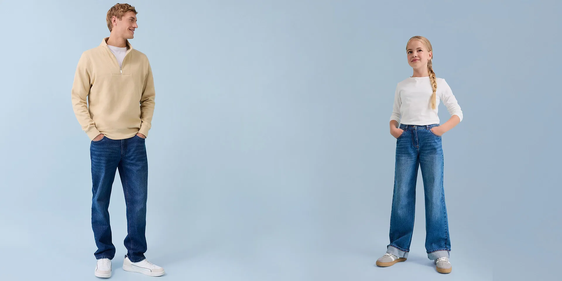 Casual fashion: Mann i sweatshirt og jente i langermet topp med jeans i bakgrunnen.