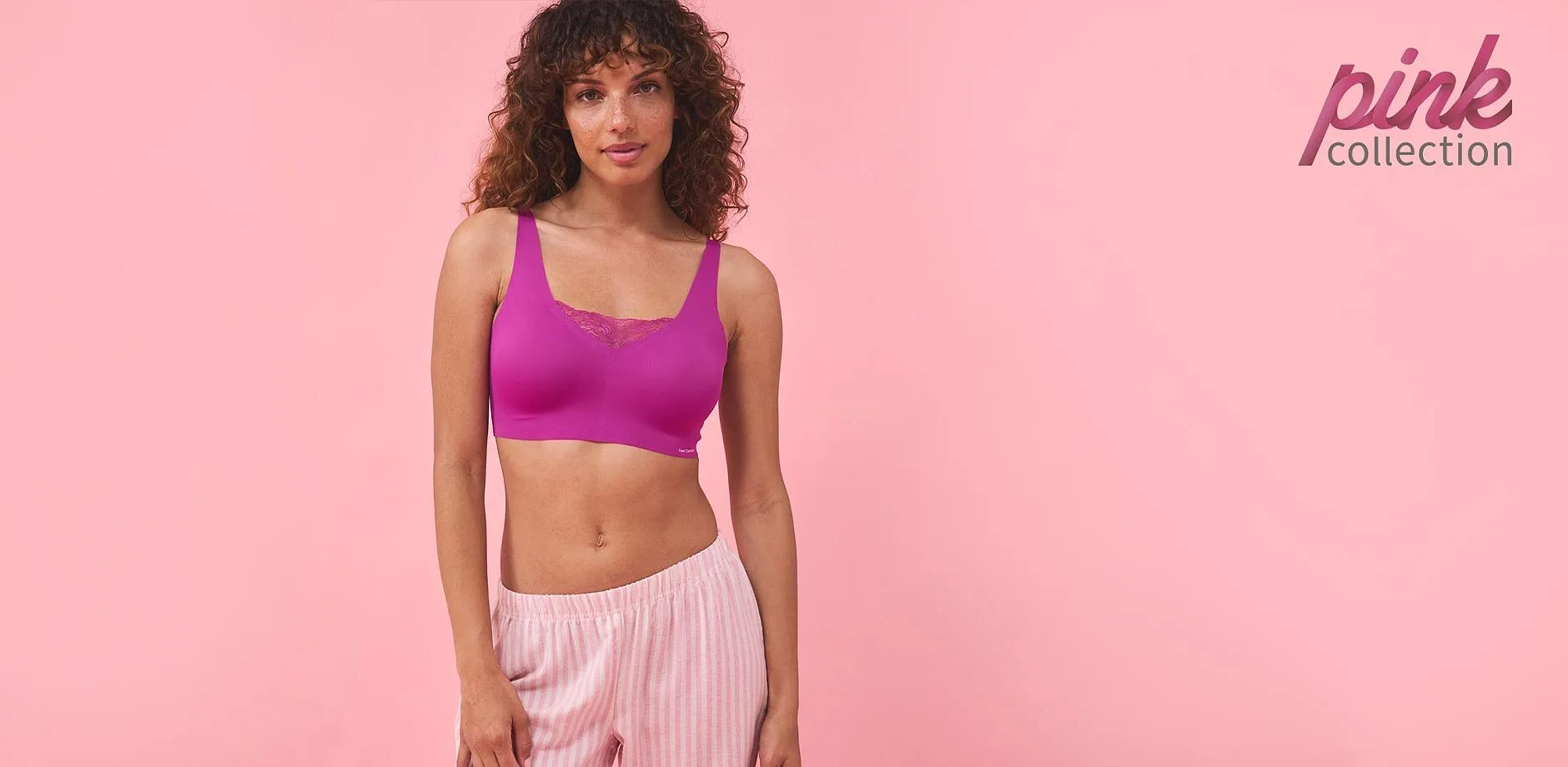 Sporty outfit: Lilla BH-topp og rosa, stripete bukse. Perfekt for trening og fritid.
