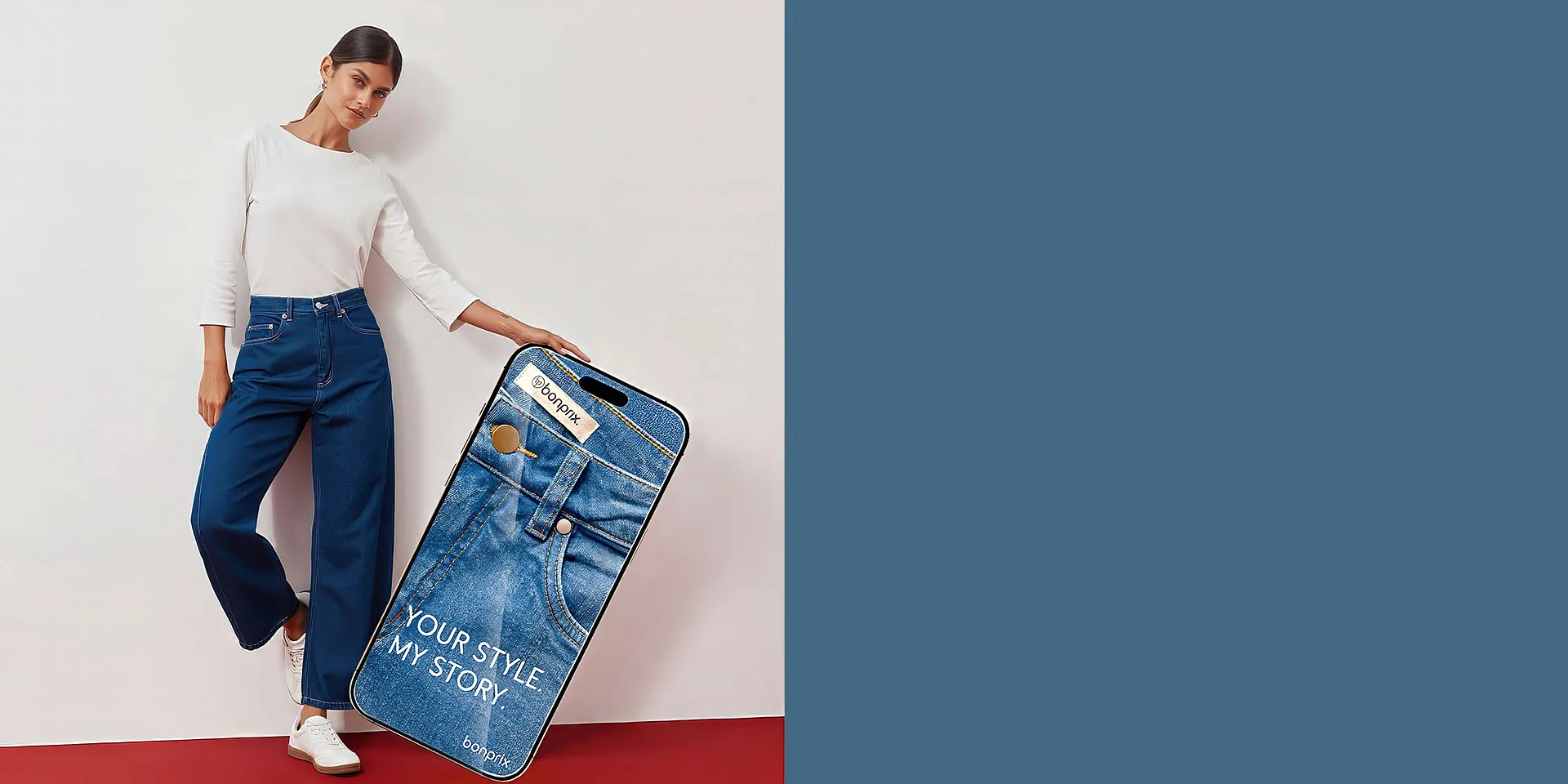 Hvit topp, moteriktige, vide jeans og sneakers.