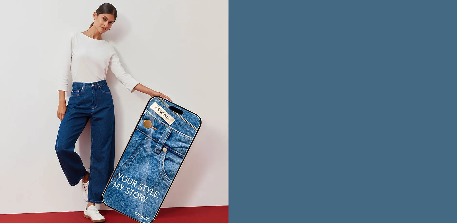 Hvit topp, moteriktige, vide jeans og sneakers.