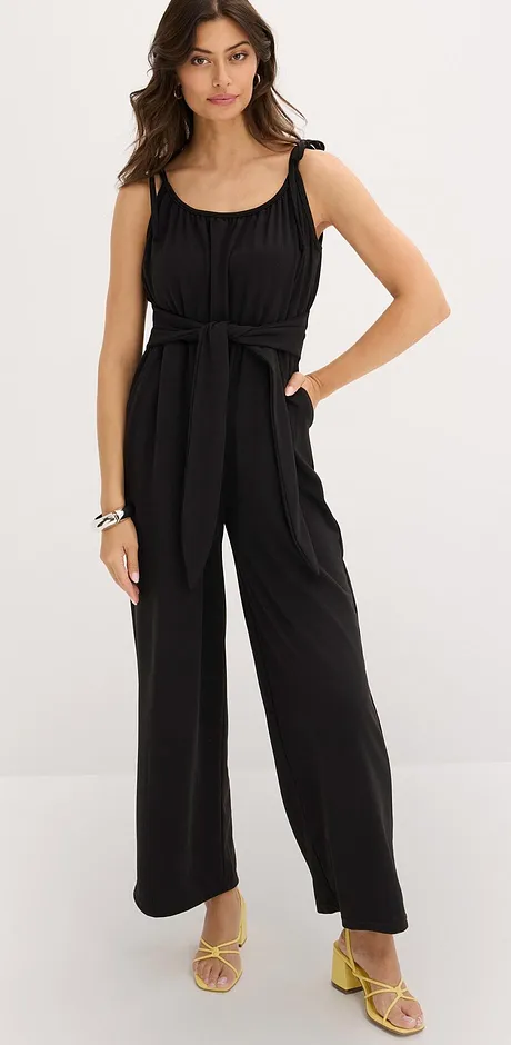 Elegant, sort jumpsuit med stropper og vide ben.