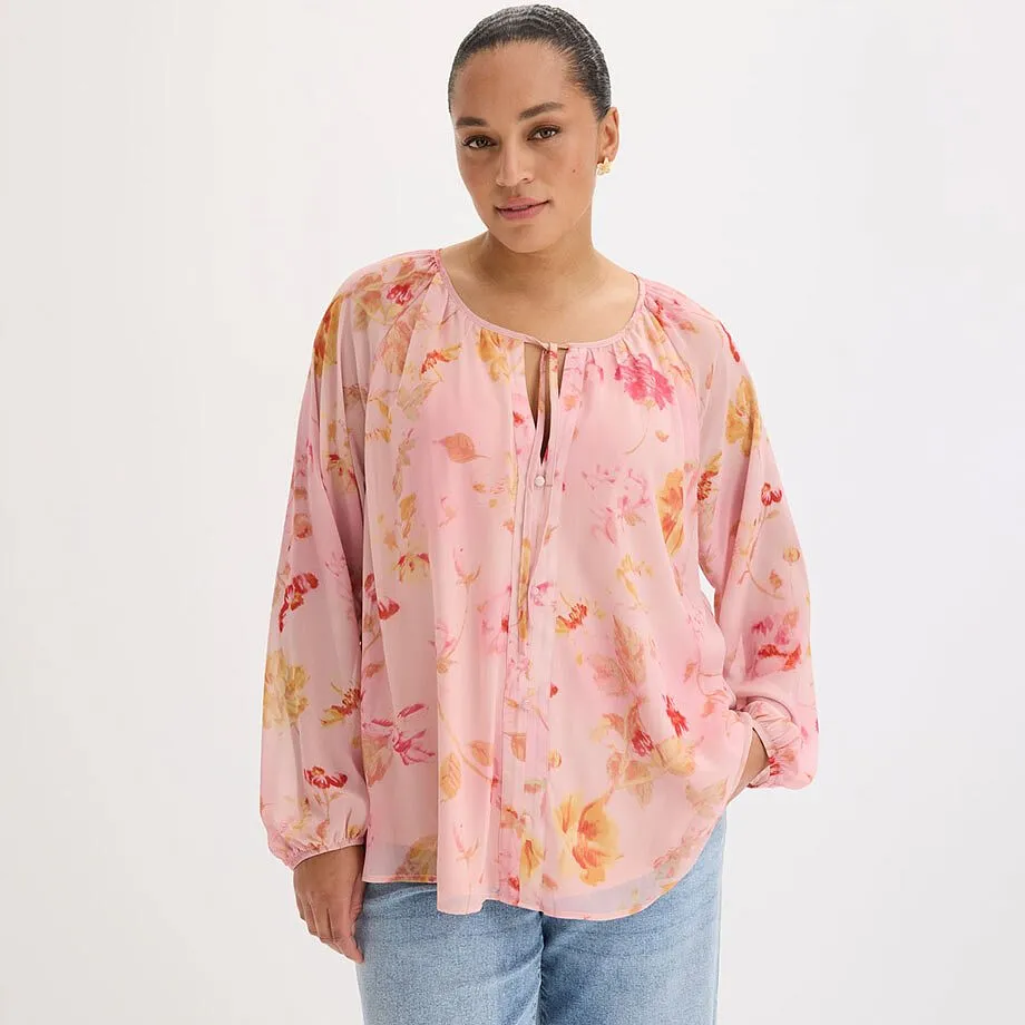 Rosa bluse med blomsterprint og knyteb&aring;nd i halsen.