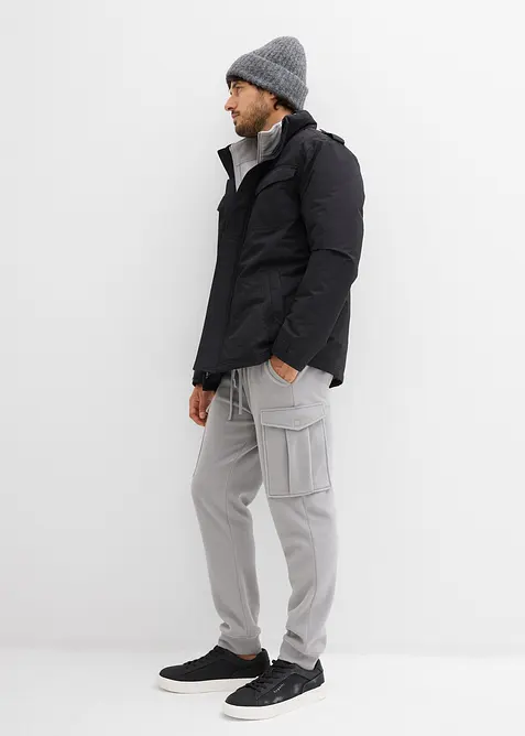 Vanntett funksjonsjakke med skjult hette og spensel på skuldrene, bonprix