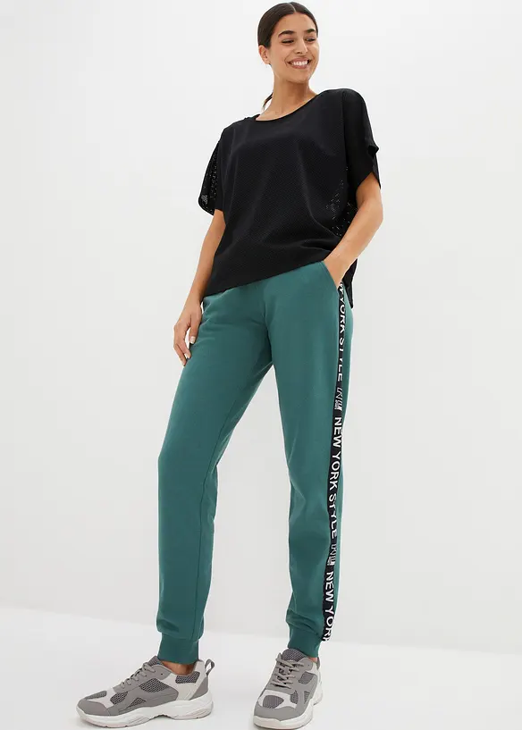 Sweatbukse med linning og Statement-print, bonprix