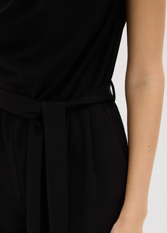 Jersey jumpsuit med skulderpolstring, bonprix