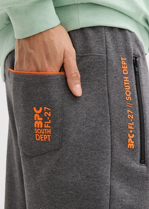 Joggebukse med praktiske glidelåslommer av økologisk bomull, bonprix